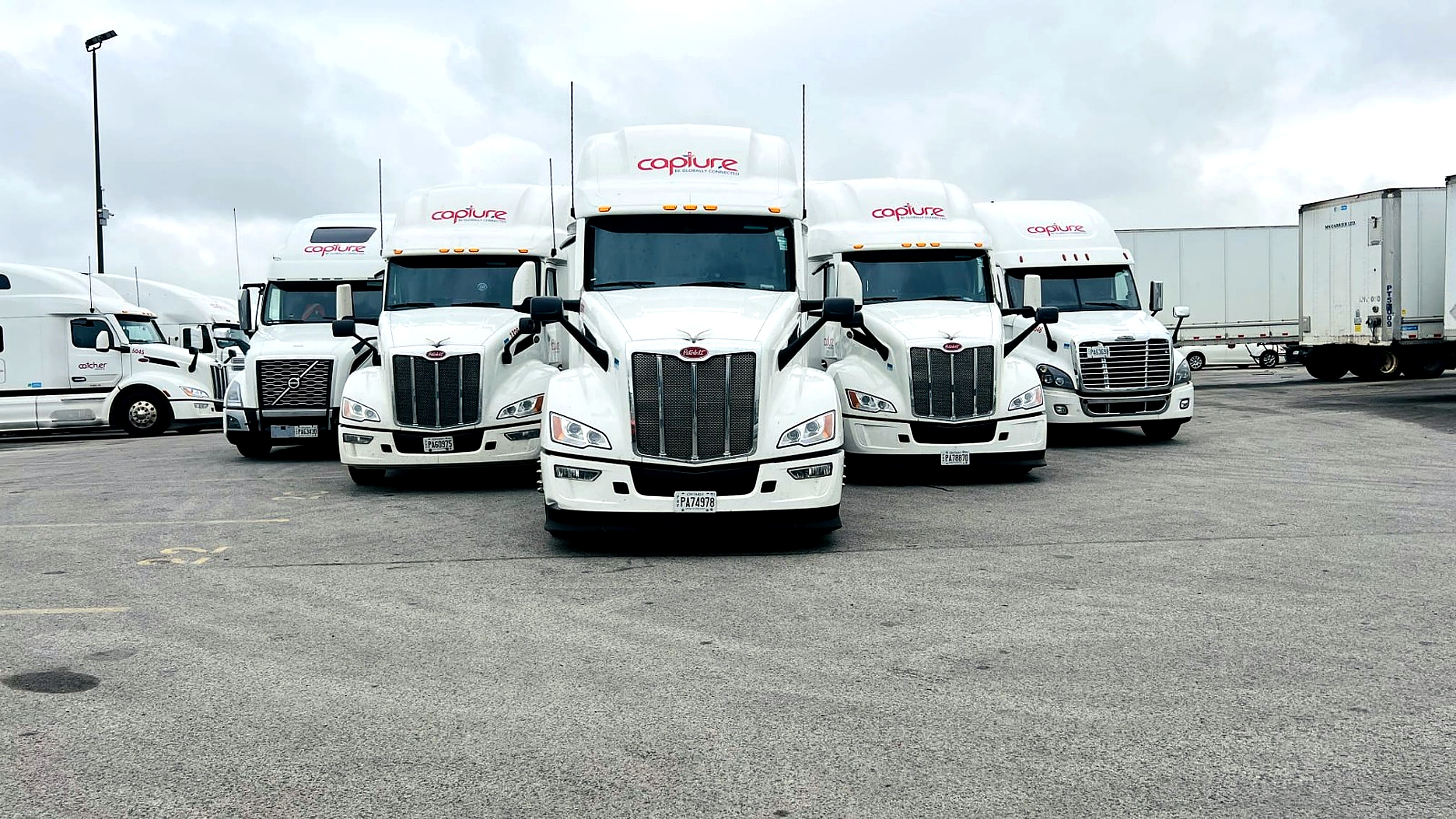 Capture Logistics fleet lined up in the yard
